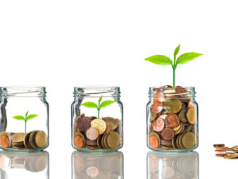 Gold,Coins,And,Seed,In,Clear,Bottle,On,White,Background,business